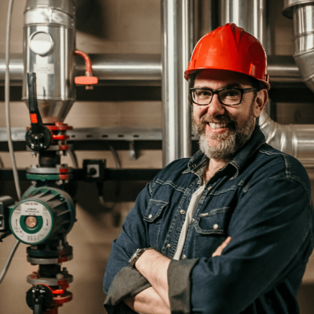 Plumber fixing pipes for Auckland commercial business